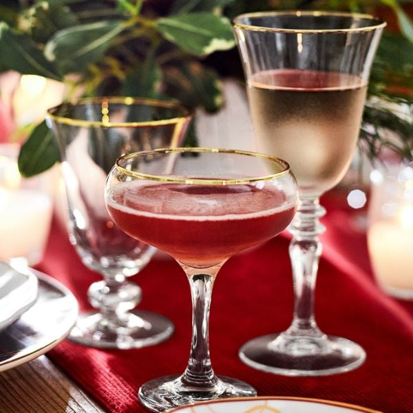 Williams Sonoma Gold Rim Champagne Coupe Glasses add a touch of luxury to couples' celebrations.