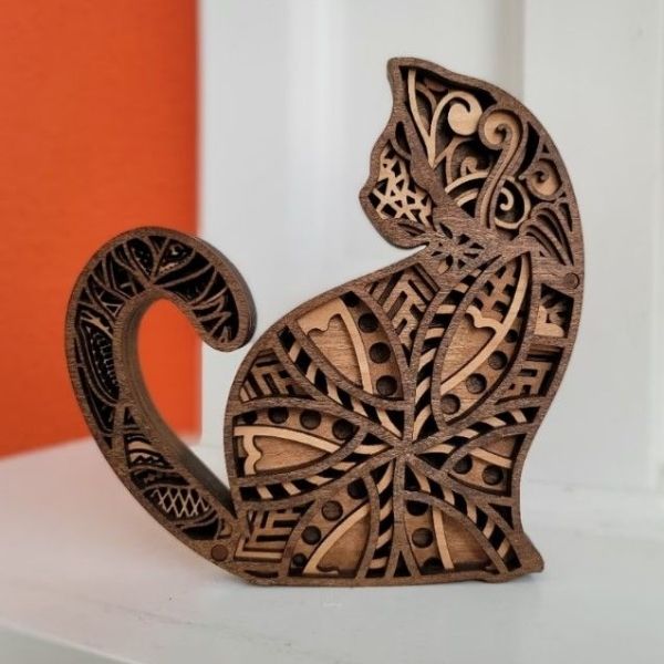 A wooden cat figurine to bring a touch of feline grace into your home decor