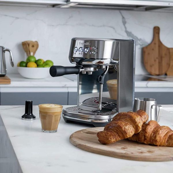 Breville Bambino Plus Espresso Machine in Royal Champagne, a luxurious and sleek gift for doctors who savor the perfect cup.