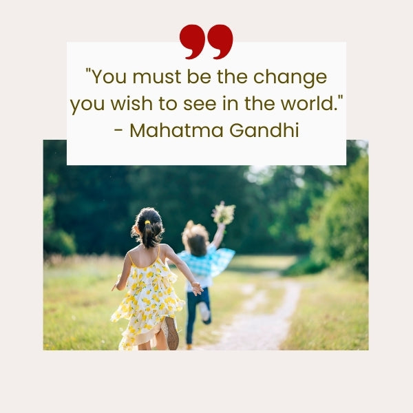 A quote by Mahatma Gandhi beside two children running through nature represents famous inspirational quotes for kids.