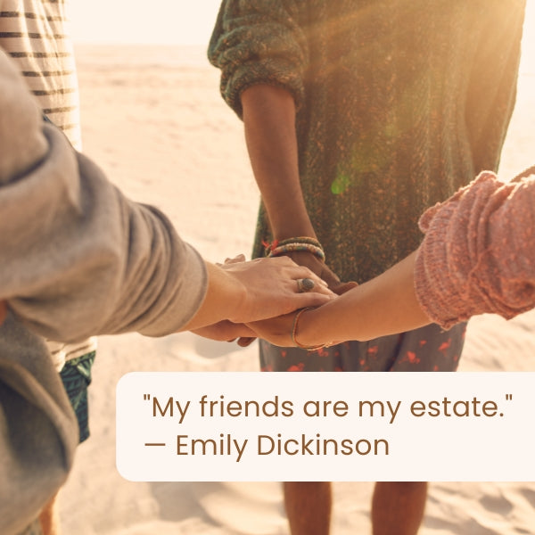 Group of friends holding hands on a sunny beach with friends are family quotes.