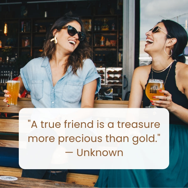 Two women laughing together over drinks, epitomizing friendship with friends are family quotes.