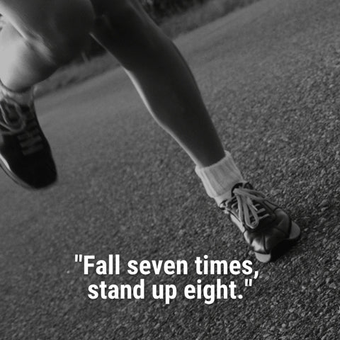 A close-up of a runner's feet pounding the pavement speaks to the endurance needed for long run motivational quotes.