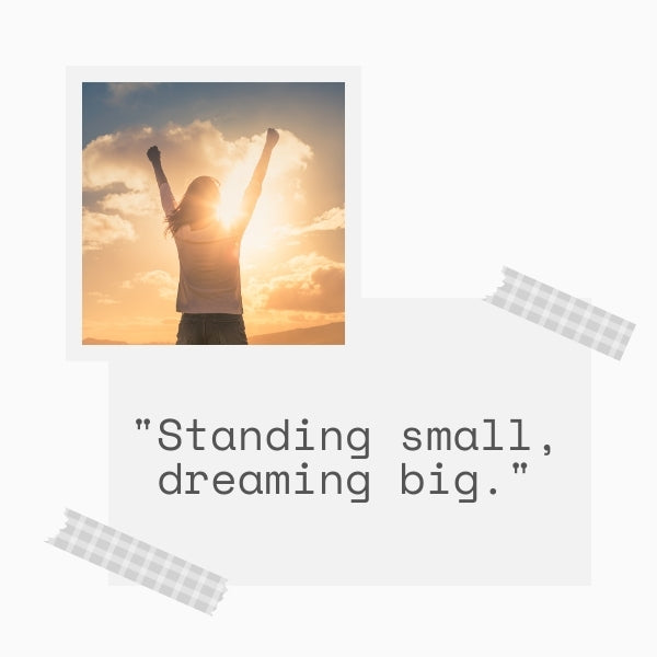 A silhouette of a woman with arms raised against a sunset, embodying short strong women quotes for inspiration.