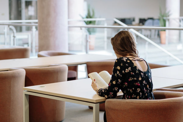 woman reading book, first trimester, pregnancy, maternity, nursing