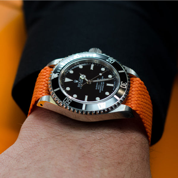 orange perlon watch band on a rolex submariner