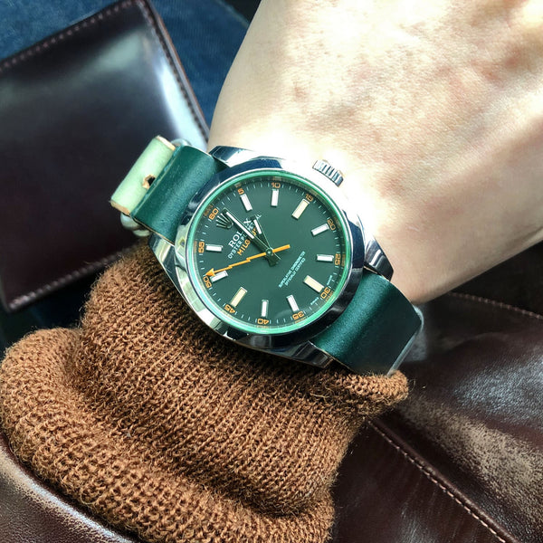 rolex milgauss watch on a wrist and green shell cordovan strap