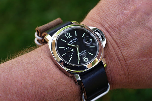 panerai watch with a brown leather watch strap