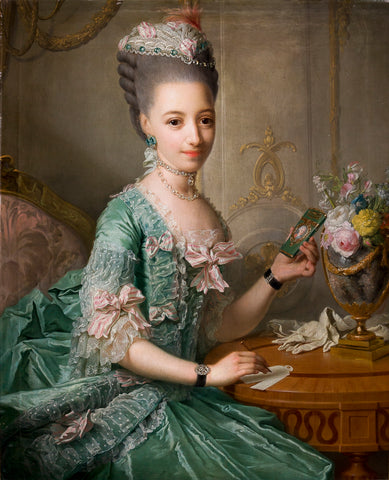 An oil painting of a young woman in fashionable dress of the 18th century. Her hair is powdered and dressed in a high style with a lacy cap on top. Her blue-green gown is elaborately trimmed and decorated with pink and white striped bows. She holds a miniature portrait of an 18th century gentleman. She is seated by a table with a vase of flowers.