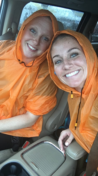 Kim and Caleigh in orange ponchos