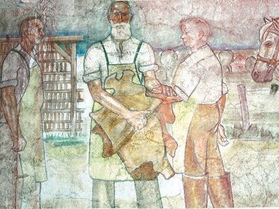 Friedrich Offermann mit zwei Meistern: Ausschnitte aus einem Fries von Barthel Gilles am Gebäude der Gerberei