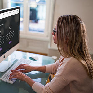 Woman working on a computer | Safe Sleep Space