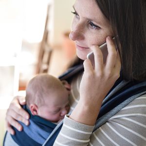 Mum holding a baby | Safe Sleep Space