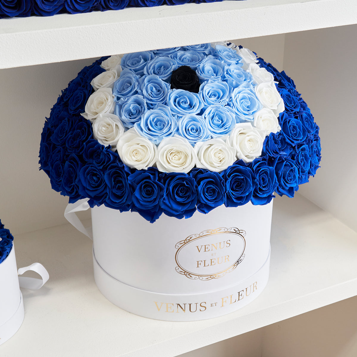 Deep Blue, Baby Blue, White Eternity Roses in A Evil Eye Symbol in Le Petit Round Box White Signature Classic Box