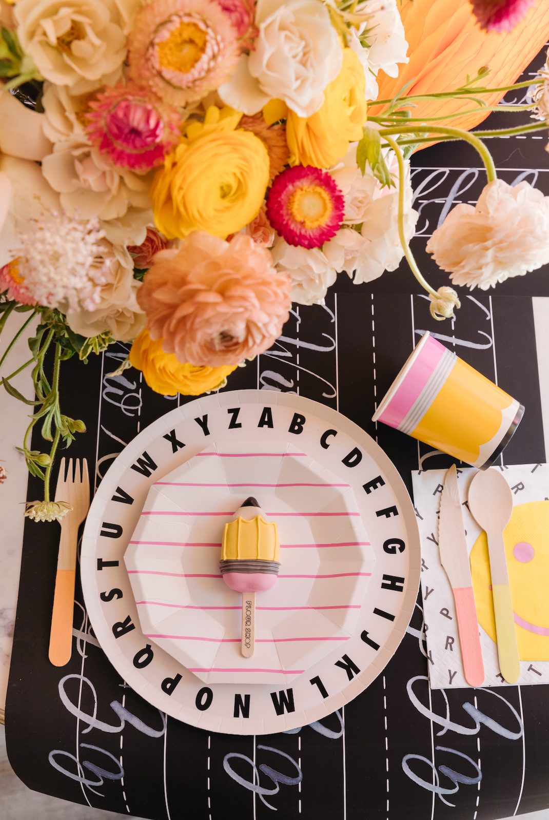 back to school table with flowers