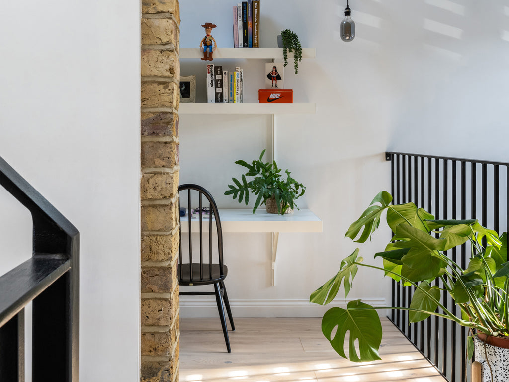 Wall mounted shelving system with long desk