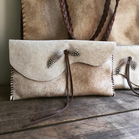 cowhide clutch bag