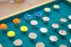 Analog handmade cufflinks awaiting colour fill in the studio Singapore designer