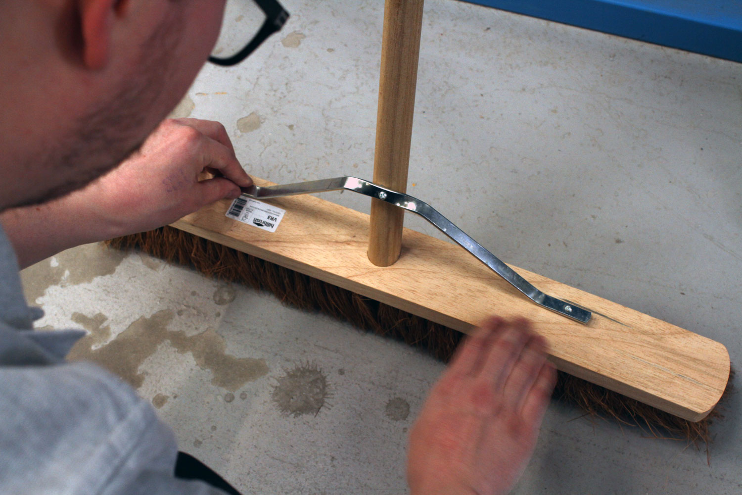 Broom being fitted with a stay