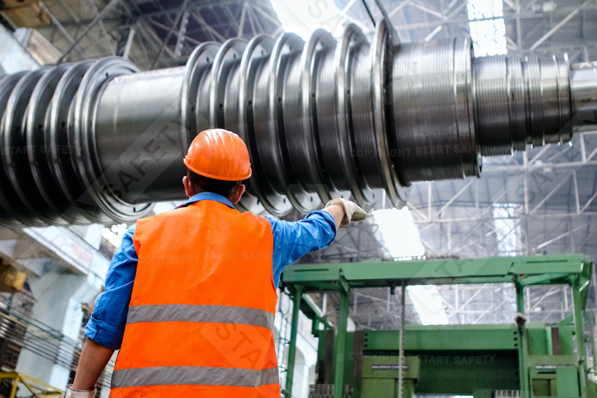 Worker At A Manufacturing Plant Wearing Hi-vis Work Wear