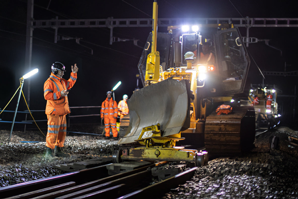 Rail Maintenance Workers With Communication Ear Defenders