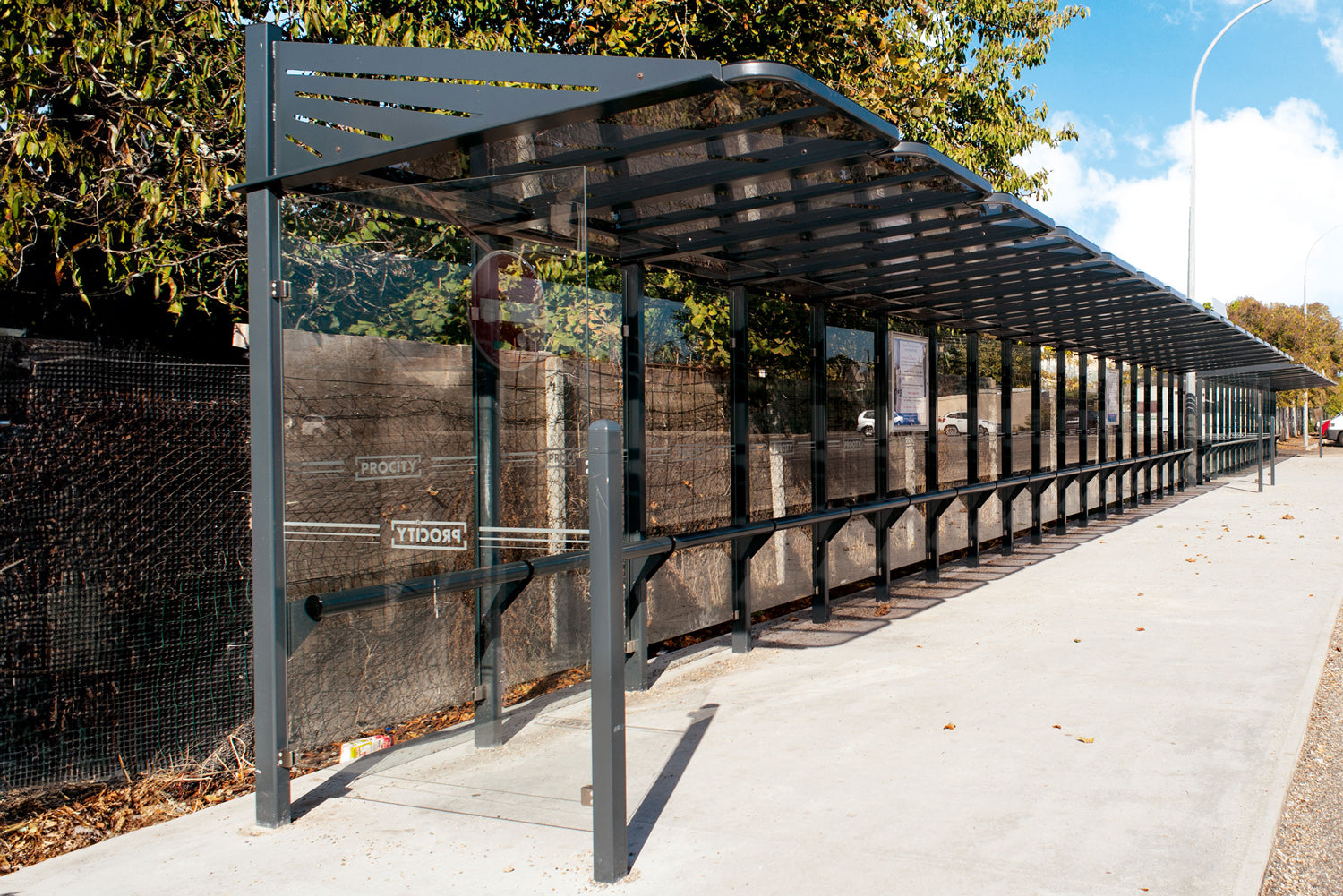 Procity Conviviale Bus Shelter Installed With Side Cladding and Perch Bench