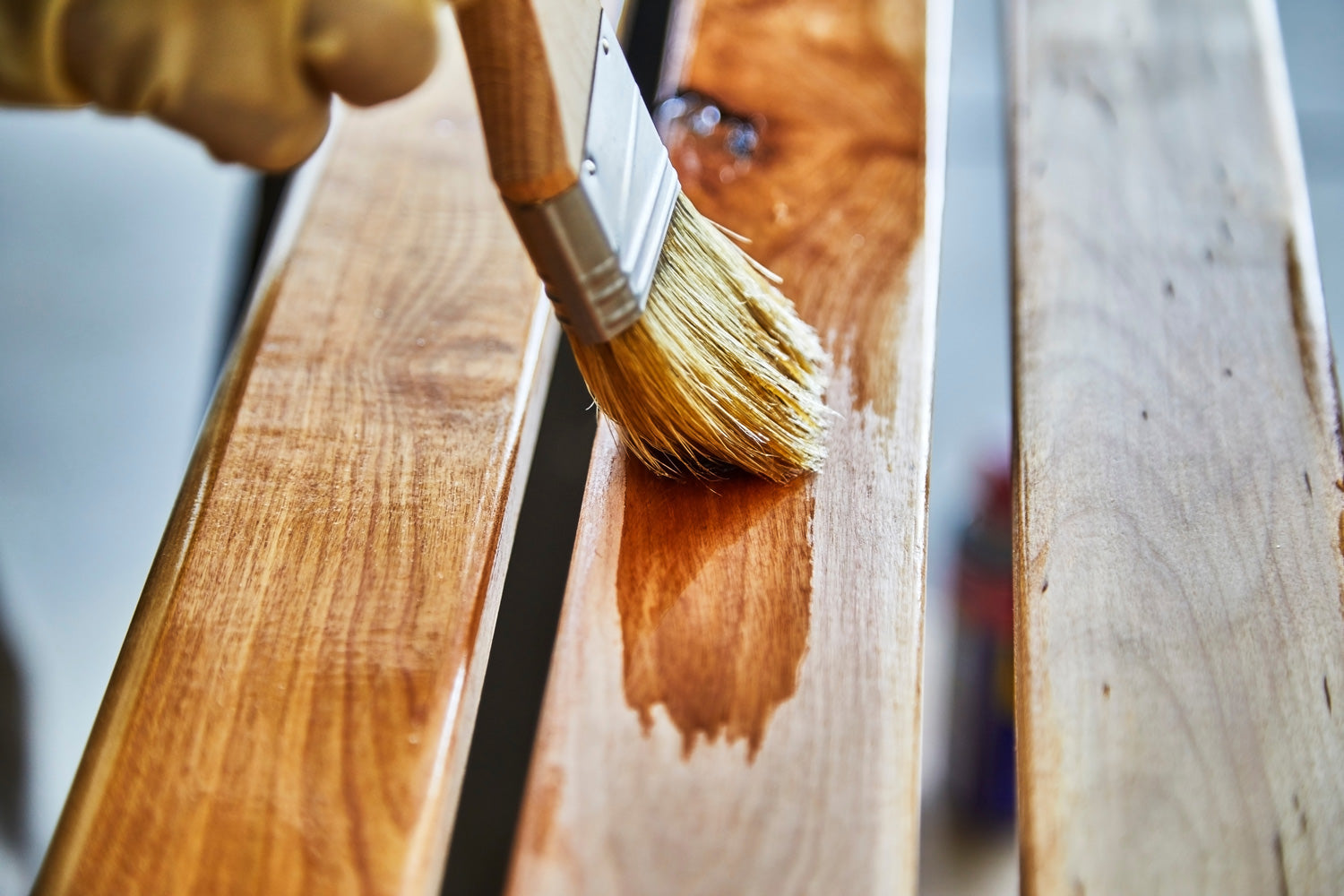 Wooden Bench Being Treated With Stainer and Sealer For Annual Maintenance