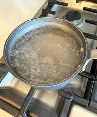 Boiling water in a pot on a stove