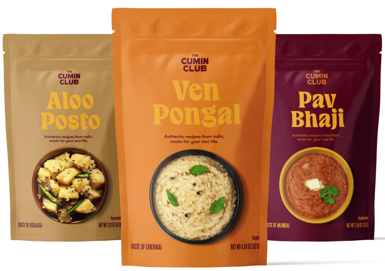 Three packets of Indian dishes: Aloo Posto, Ven Pongal, Pav Bhaji.