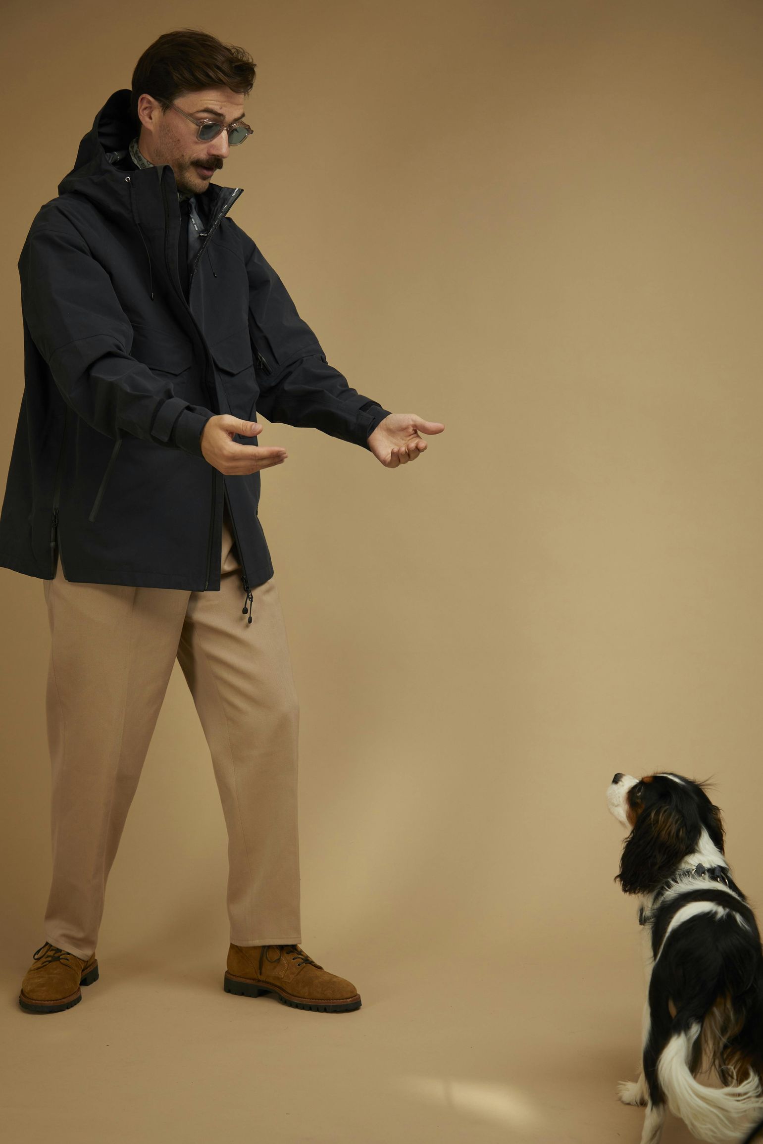 man and dog in photo studio