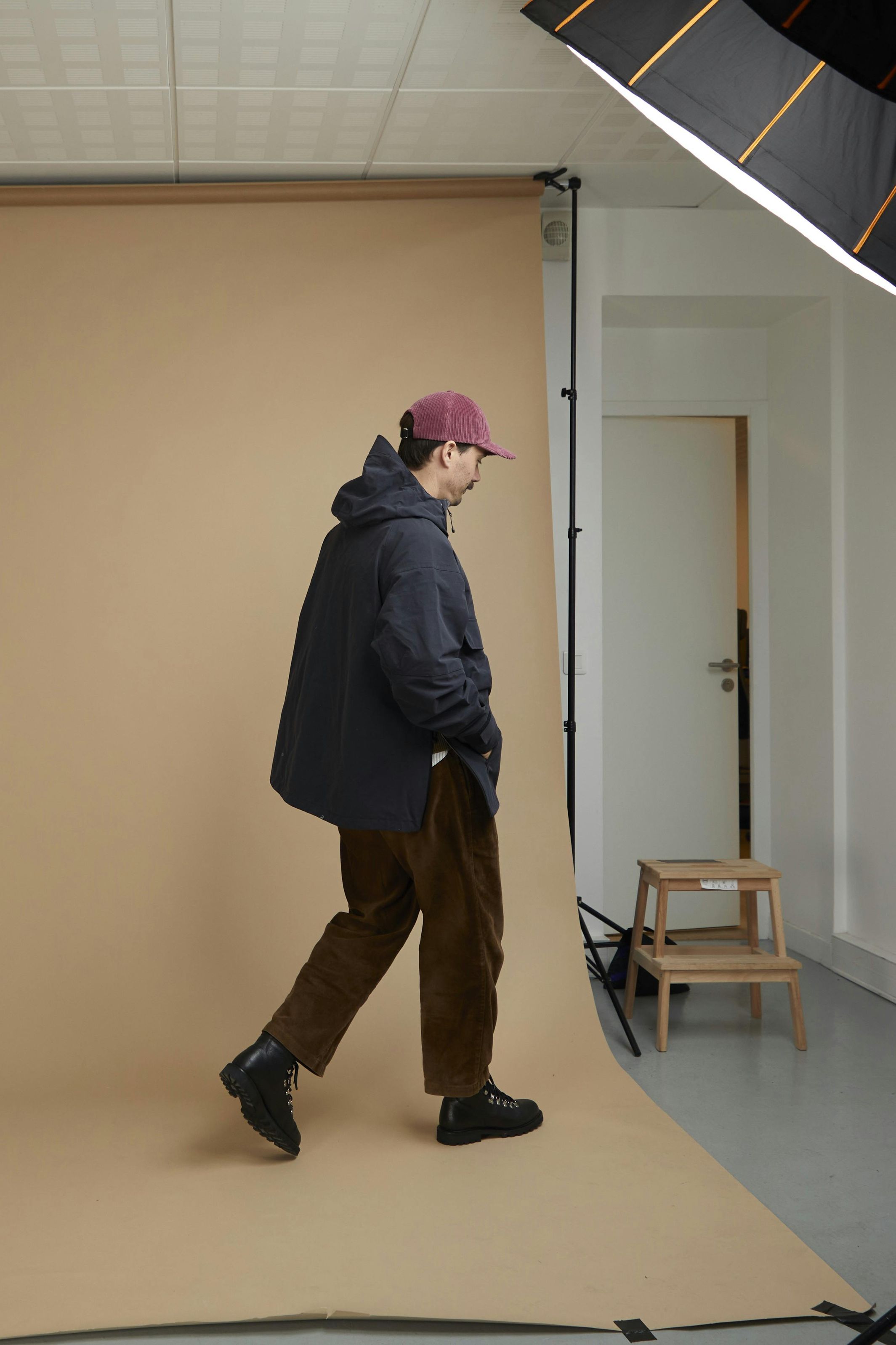 man in studio shooting walking