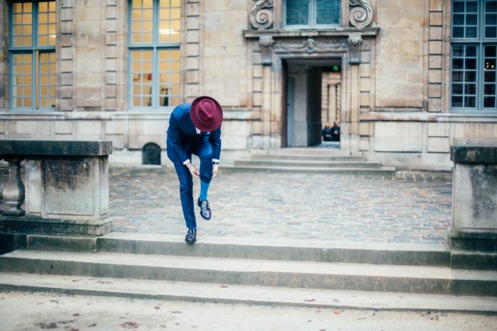 blue suit burgundy hat