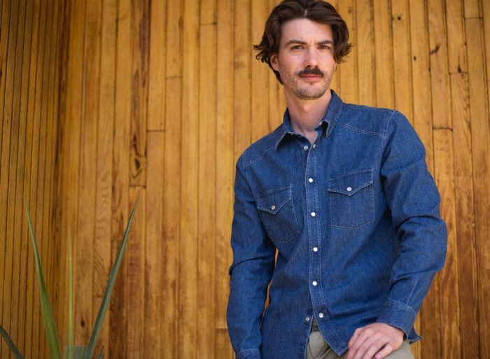 Man in indigo western shirt.