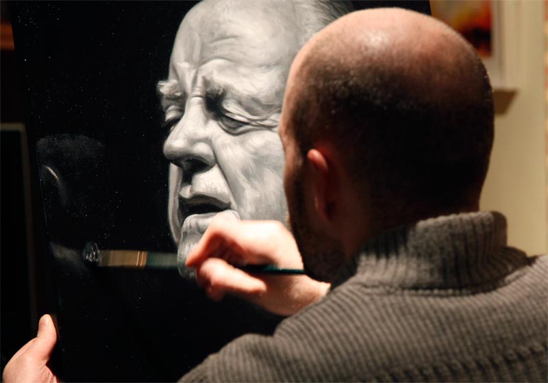 Oil painting of Christy Moore on easel