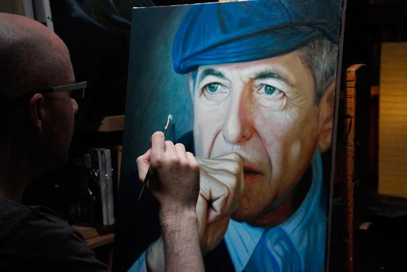 Artist Vincent Keeling painting a portrait of Leonard Cohen