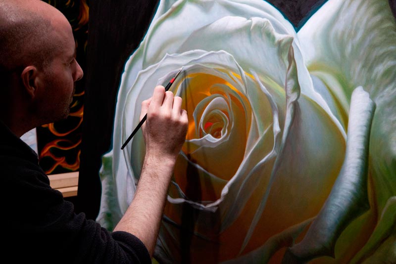 Artist Vincent Keeling painting a white rose oil painting