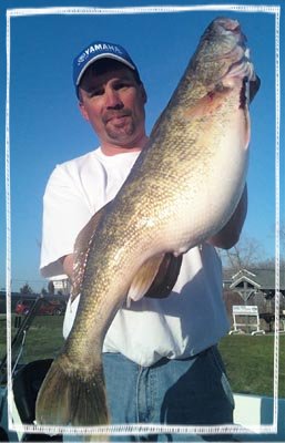 Brett King holding a large fish.