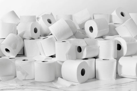 several rolls of toilet paper piled up