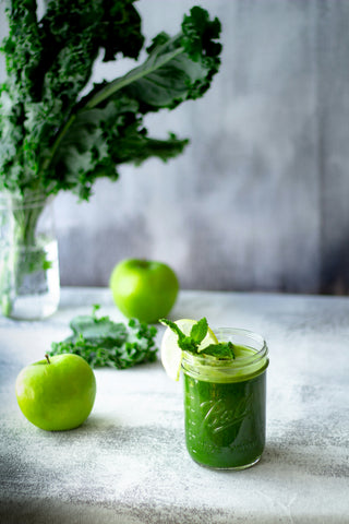 green-apple-fruit-in-clear-glass-cup