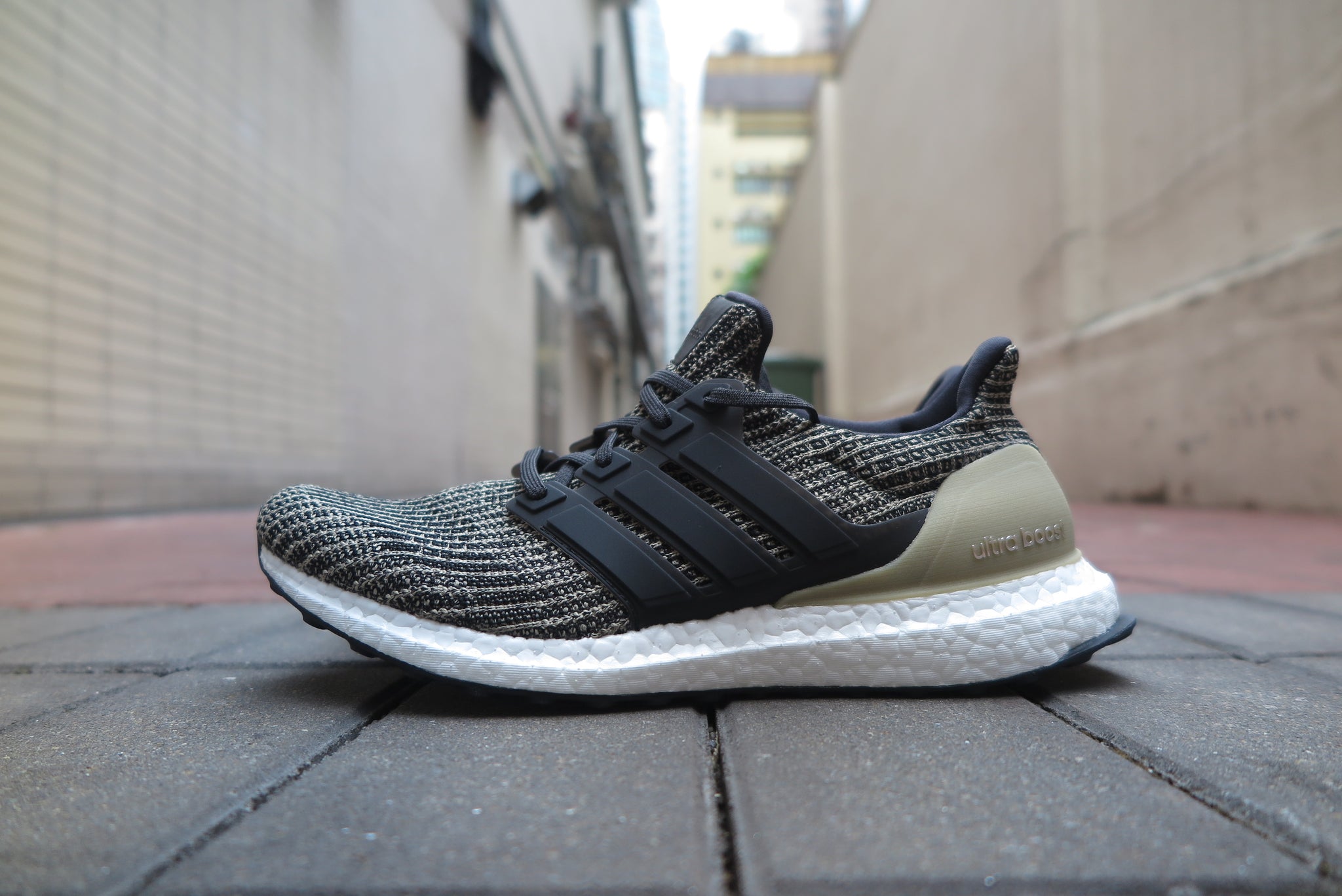 adidas ultra boost black raw gold