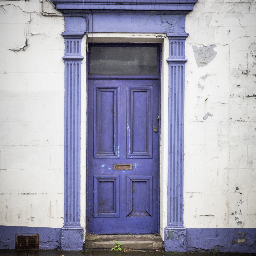 purple front door cracked paint