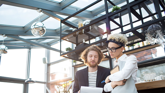 Man and Women in the Office Discussing Work