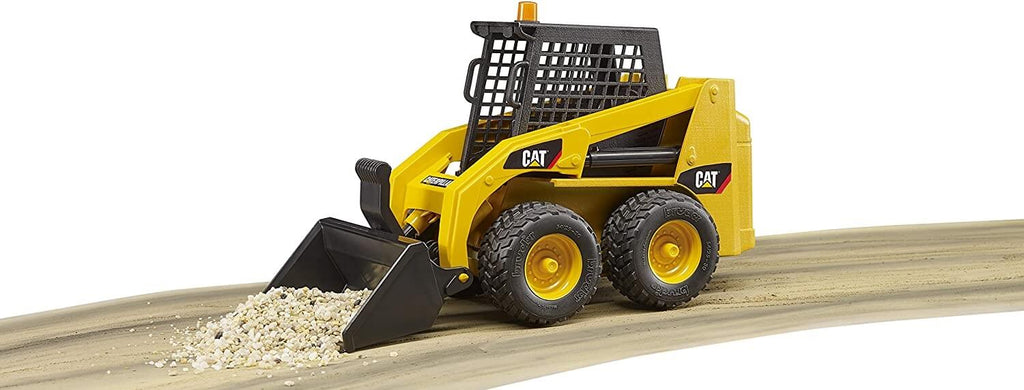 Bruder CAT Skid Steer Loader using the front plow to move gravel.