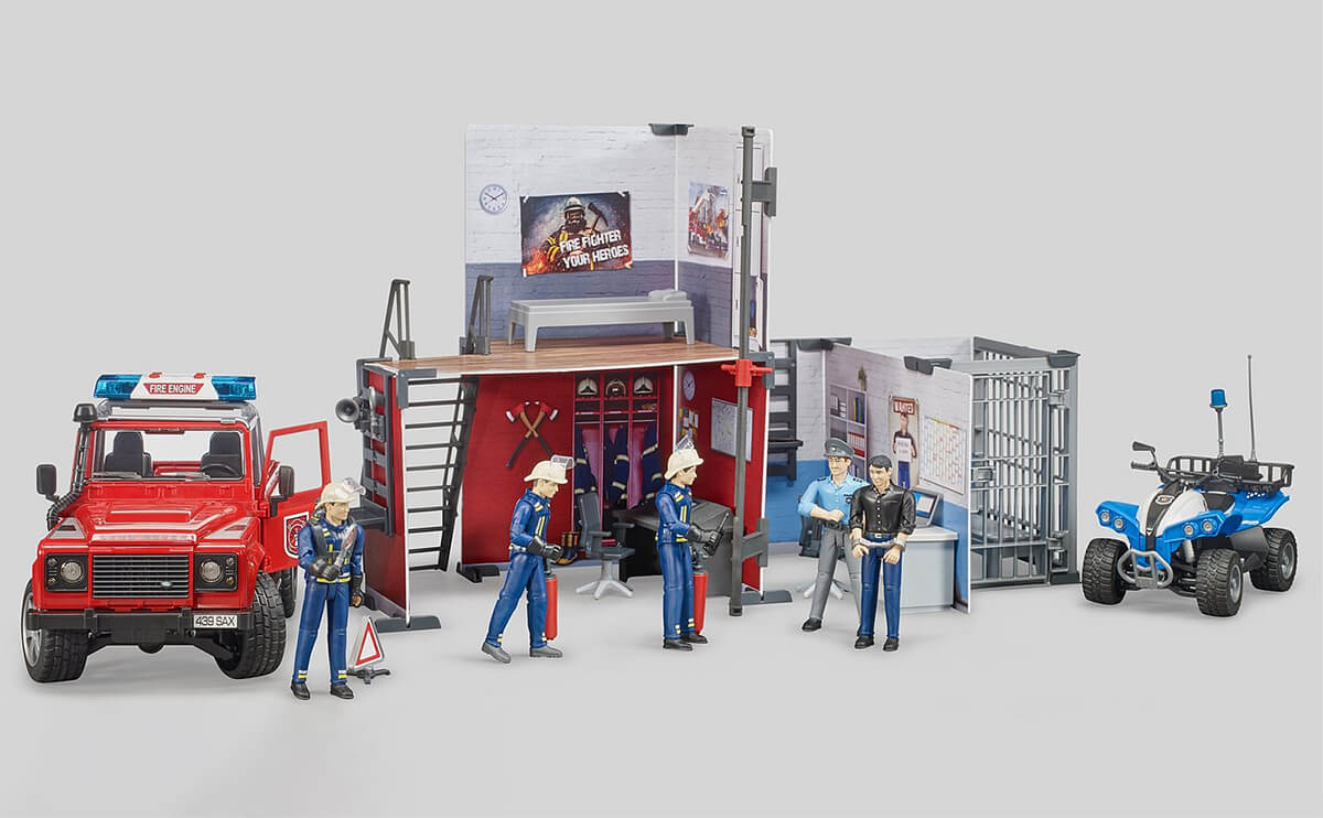 Two Bruder bWorld playsets (fire and police) combined to make one large playset.