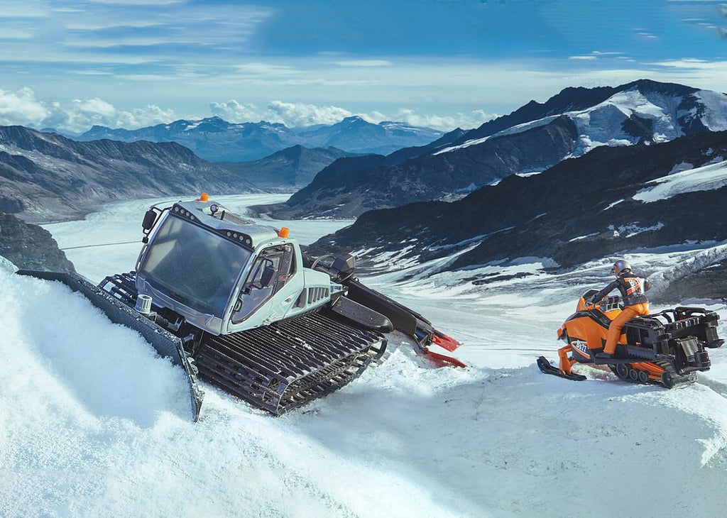 Bruder snowplow and snowmobile is difficult to tell from the real thing.