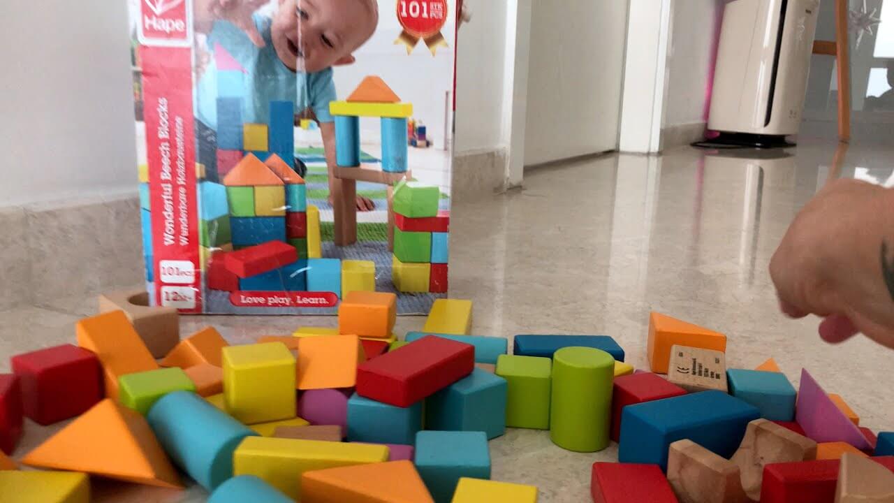 Hape wooden blocks on the floor and ready to be played with.