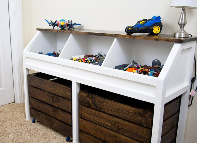 Large wooden toy box where the large bottom pulls out like drawers. It also includes storage bins.