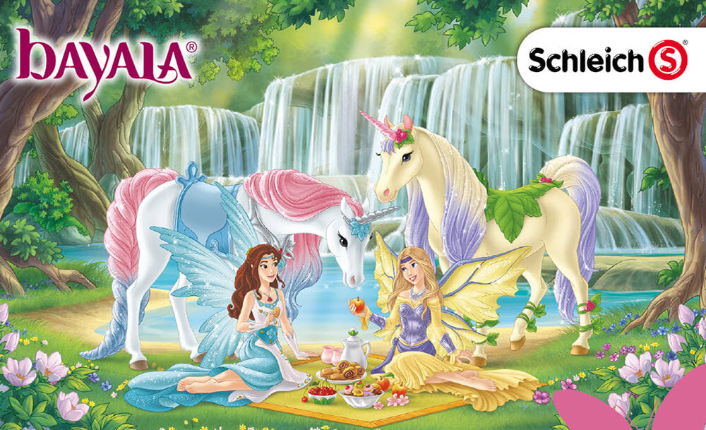 Schleich bayala scene, featuring two unicorns and two fairy princesses sitting down in a mystical forest, having a picnic.