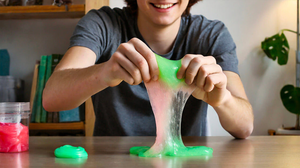 Teenage boy doing a daily slime therapy session.