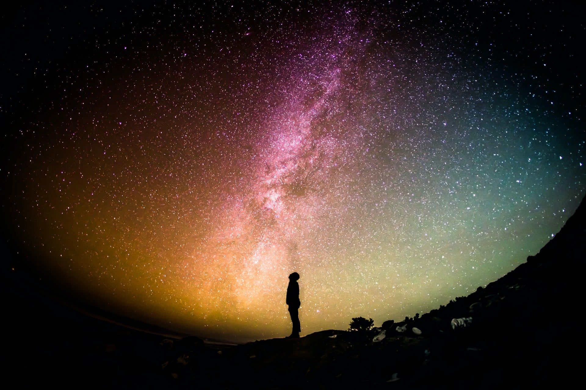 Photo of someone looking up at the Milky Way